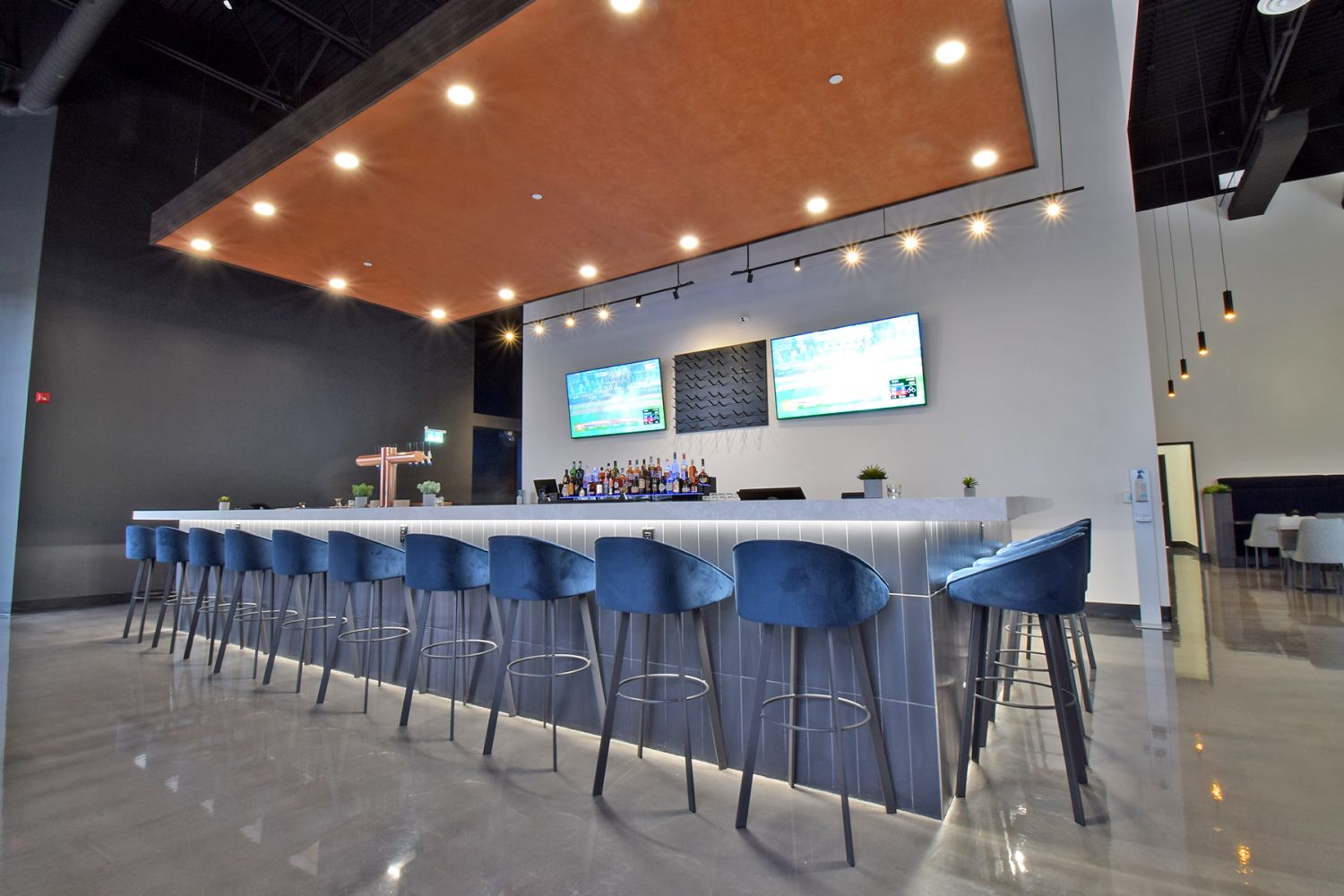 An inviting and stylish restaurant bar in Barrie, Ontario, featuring a sleek and contemporary design, cozy seating, and a well-stocked bar.